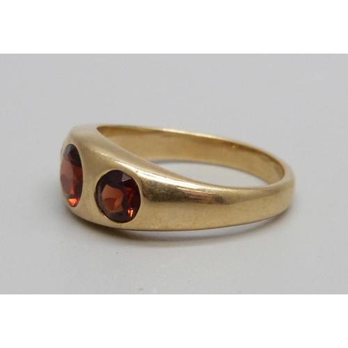 977 - A 14ct gold and red stone ring, 6g, R