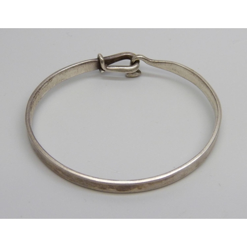 987 - A silver Georg Jensen bangle, Torun, 204, (45mm x 56mm)