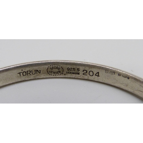 987 - A silver Georg Jensen bangle, Torun, 204, (45mm x 56mm)