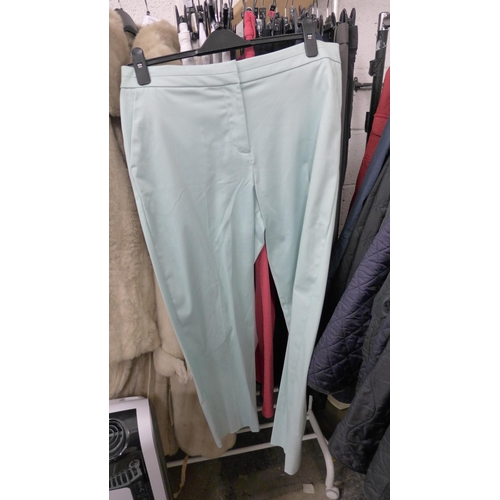 2388 - 18 Pairs of tagged unused men's and women's Marks & Spencer trousers, mixed sizes and colours