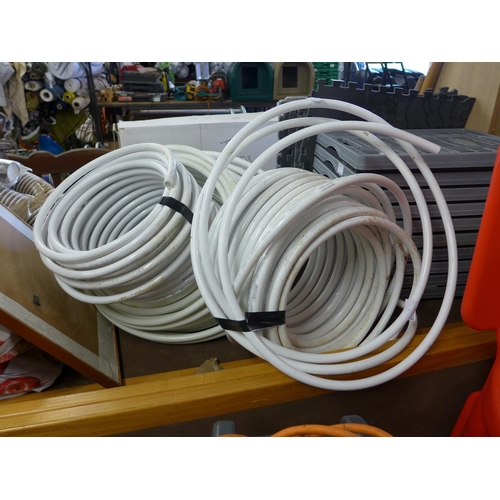 2433 - Approx. 5 x 20 mtr rolls of butt-welded plastic water pipe