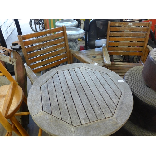 2452 - Teak garden love seat and matching 60cm diameter table