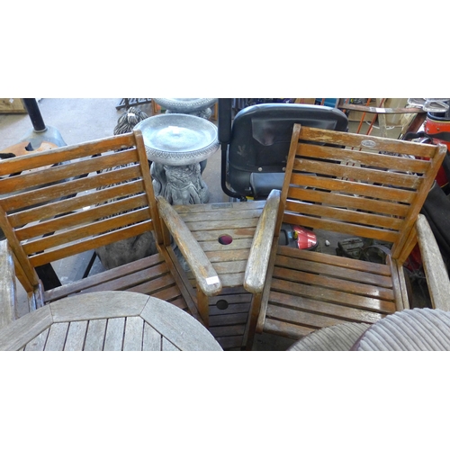 2452 - Teak garden love seat and matching 60cm diameter table