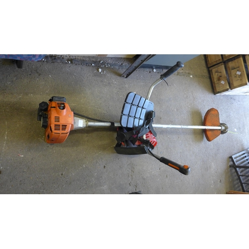 2454 - Petrol driven Stihl garden strimmer with harness