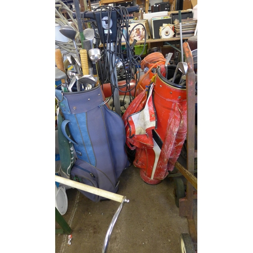 2461 - 3 Golf bags and qty. of clubs, ball retriever, brollies