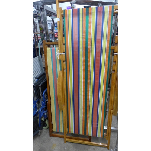 2496 - 2 Full size wood-fabric lightly used deck chairs