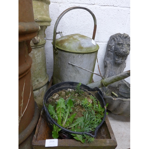 2514 - Cast iron pig trough with watering can and plastic planter