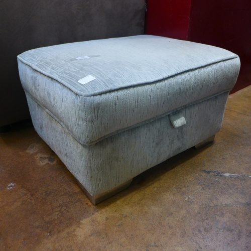 1365 - A silver upholstered ottoman footstool