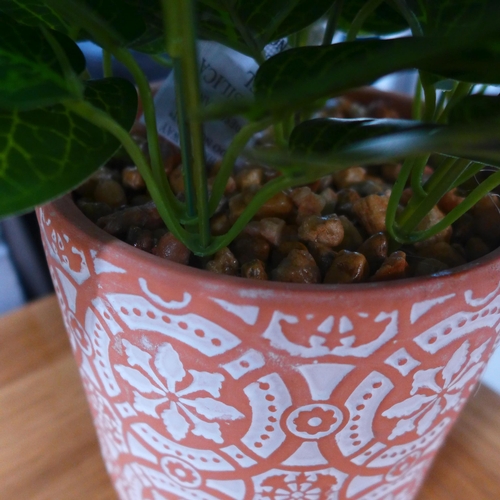 1420 - A faux green plant in a Moroccan tile pattern pot (63098104)