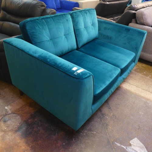 1444 - A teal velvet pinched back two seater sofa