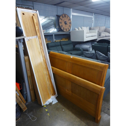 1555 - An oak double sleigh bed frame