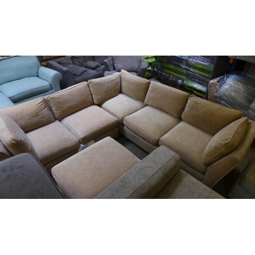 1606 - A sand upholstered corner sofa and footstool