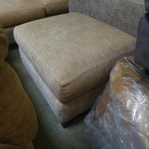 1606 - A sand upholstered corner sofa and footstool