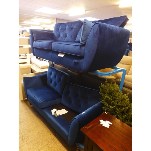 1655 - A deep ocean blue velvet three seater sofa - tear on front of sofa and a deep ocean blue velvet thre... 