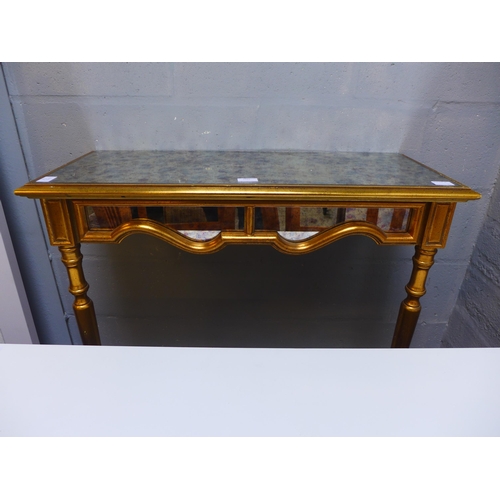 1669 - An opaque glass and gold effect wall mounted console table