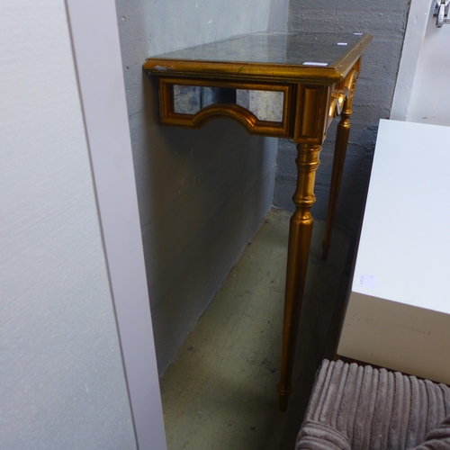 1669 - An opaque glass and gold effect wall mounted console table