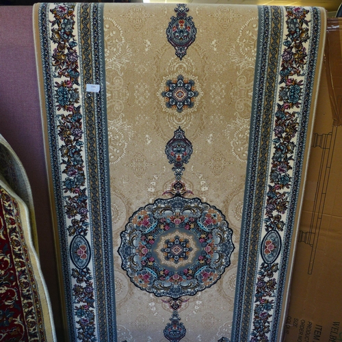 1586 - A cream ground fine woven Iranian full pile runner, unique medallion design