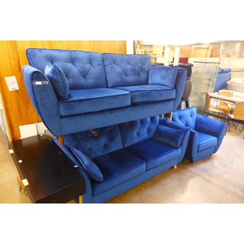 1556 - A pair of blue Hoxton velvet three seater sofas and arm chair