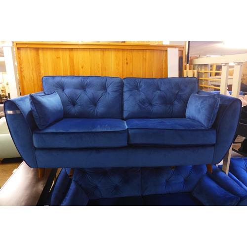 1556 - A pair of blue Hoxton velvet three seater sofas and arm chair