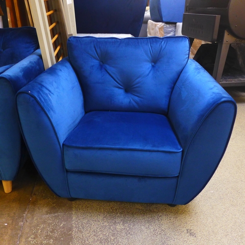 1556 - A pair of blue Hoxton velvet three seater sofas and arm chair