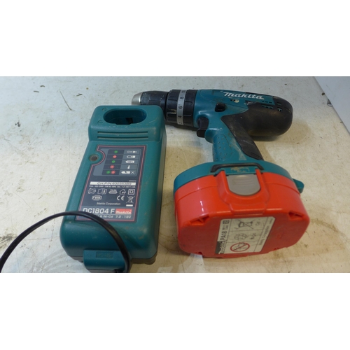 2010 - Makita 8391D cordless drill with charger and battery