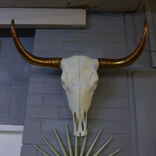 1999 - A large bison skull with gold horns