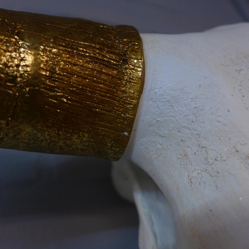 1999 - A large bison skull with gold horns