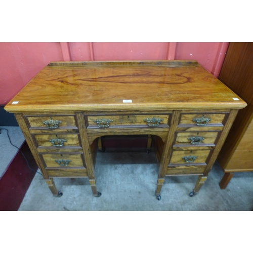 4 - A Victorian Maple & Co. figured walnut desk