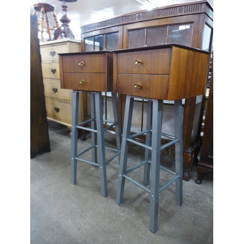 73 - A pair of afromosia two drawer chests on metal stands