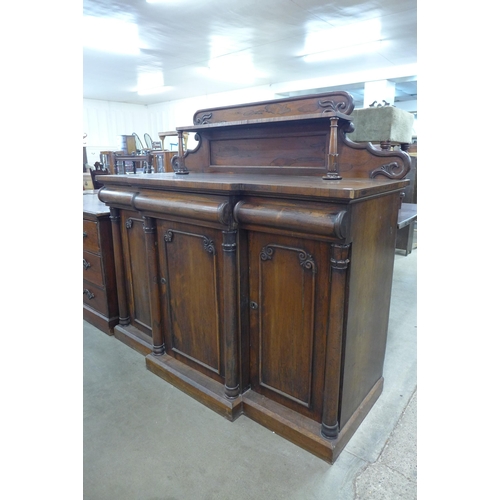 100 - A William IV rosewood breakfront three door sideboard