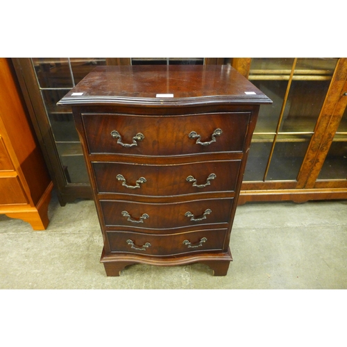 107 - A small mahogany serpentine chest of drawers