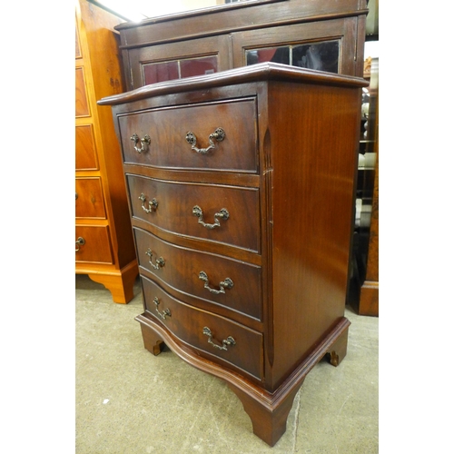 107 - A small mahogany serpentine chest of drawers