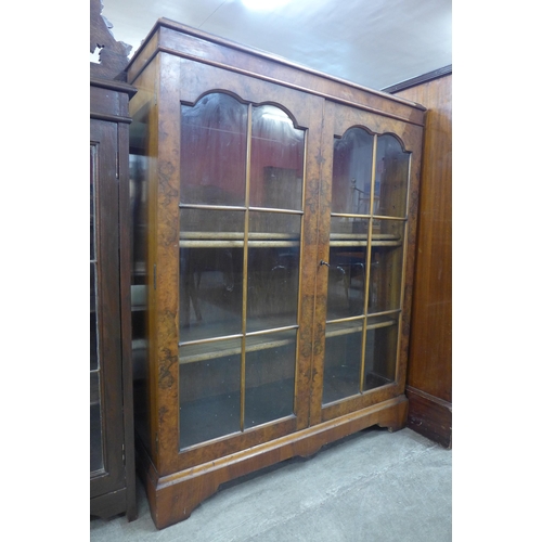 110 - A burr walnut two door bookcase