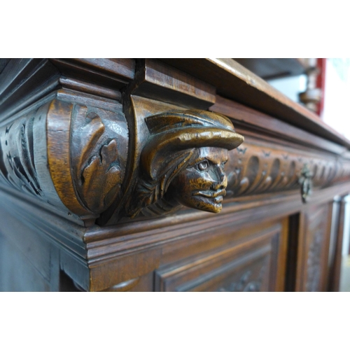 112 - A late 19th/early 20th Century French carved oak and walnut dresser