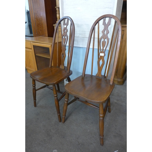 116 - A pair of elm and beech kitchen chairs