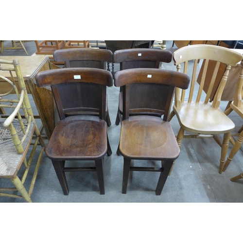 117 - A set of four early 20th Century Gaskell & Chambers oak tavern chairs