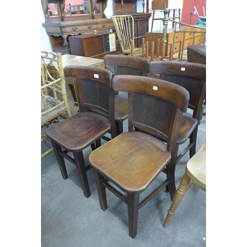 117 - A set of four early 20th Century Gaskell & Chambers oak tavern chairs