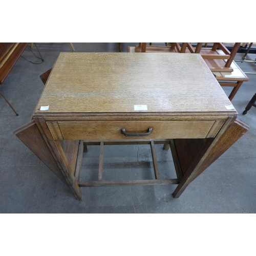 119 - A small Art Deco oak desk, manner of Heals