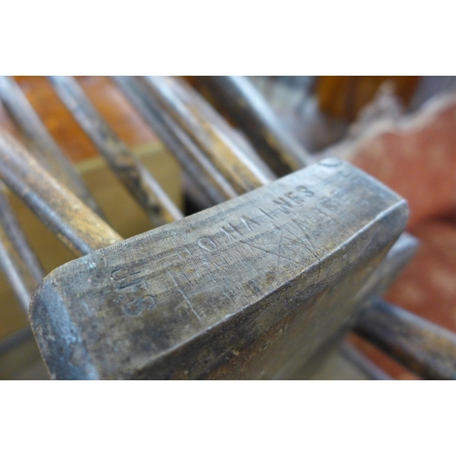 126 - A pair of Victorian elm and beech Windsor kitchen chairs, stamped O'Haines, High Wycombe and an oak ... 