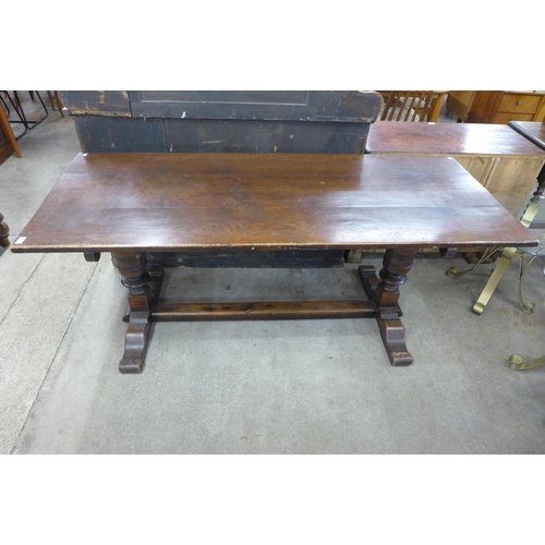 131 - A 17th Century style oak refectory table