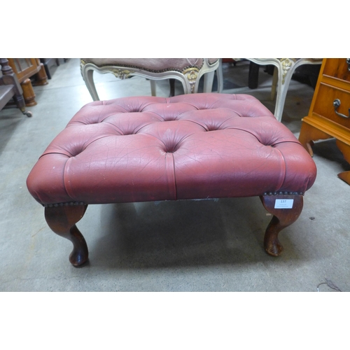 137 - An oxblood leather footstool