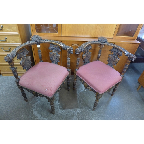 148 - A pair of Italian Baroque style carved corner chairs