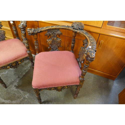 148 - A pair of Italian Baroque style carved corner chairs