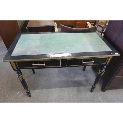 150 - An early 20th Century French ebonised and gilt metal mounted two drawer lady's writing table