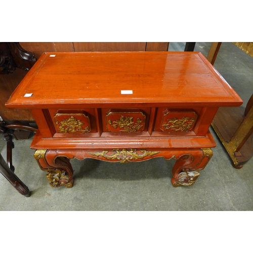 171 - A Chinese scarlet lacquered and parcel gilt three drawer opium table