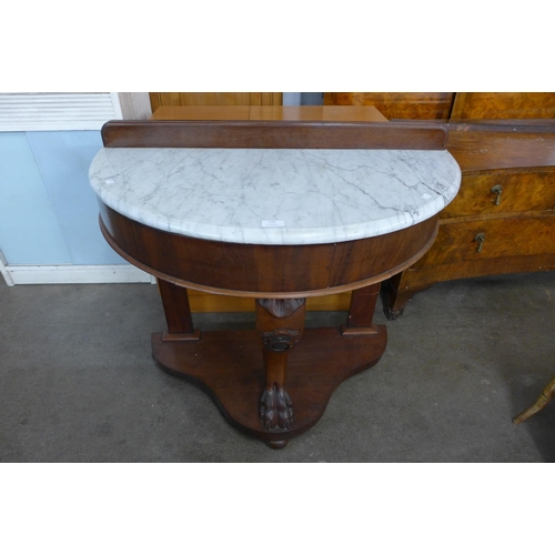 172 - A Victorian mahogany and marble topped demi-lune washstand