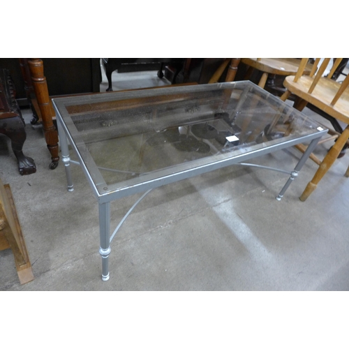 177 - An Italian painted brass and glass topped coffee table