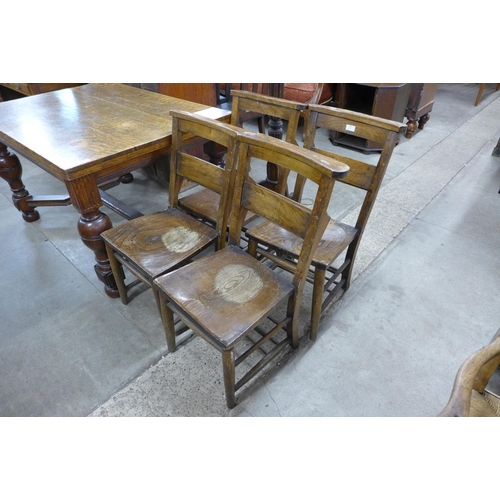 183 - A set of four early 20th Century elm and beech chapel chairs