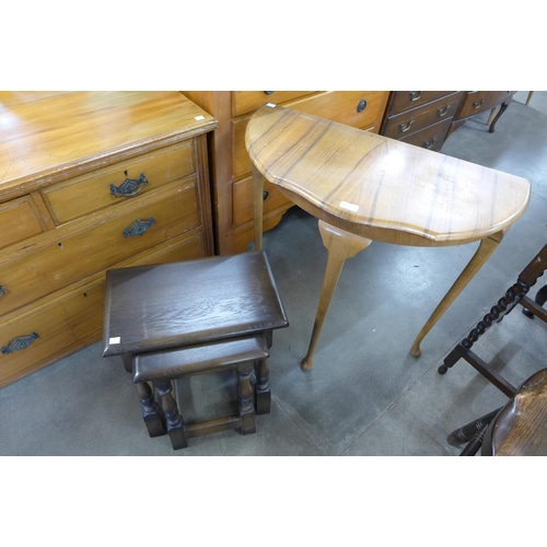 192 - A walnut demi lune hall table and an oak nest of two tables