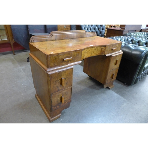 20 - An Art Deco figured walnut desk